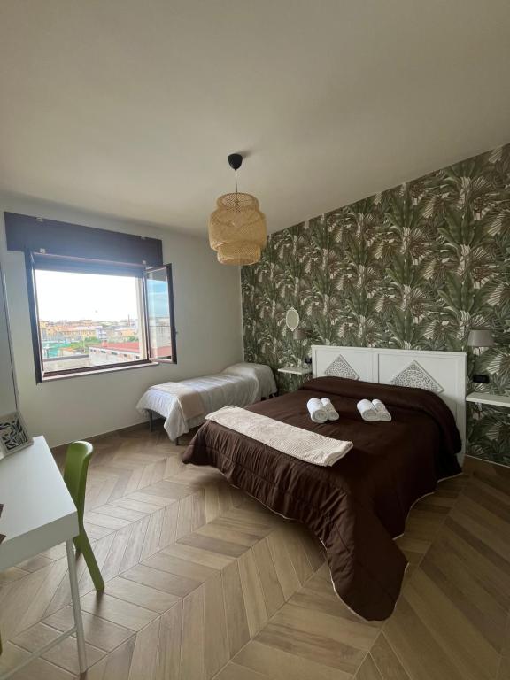 Ένα ή περισσότερα κρεβάτια σε δωμάτιο στο B&B La Rotonda