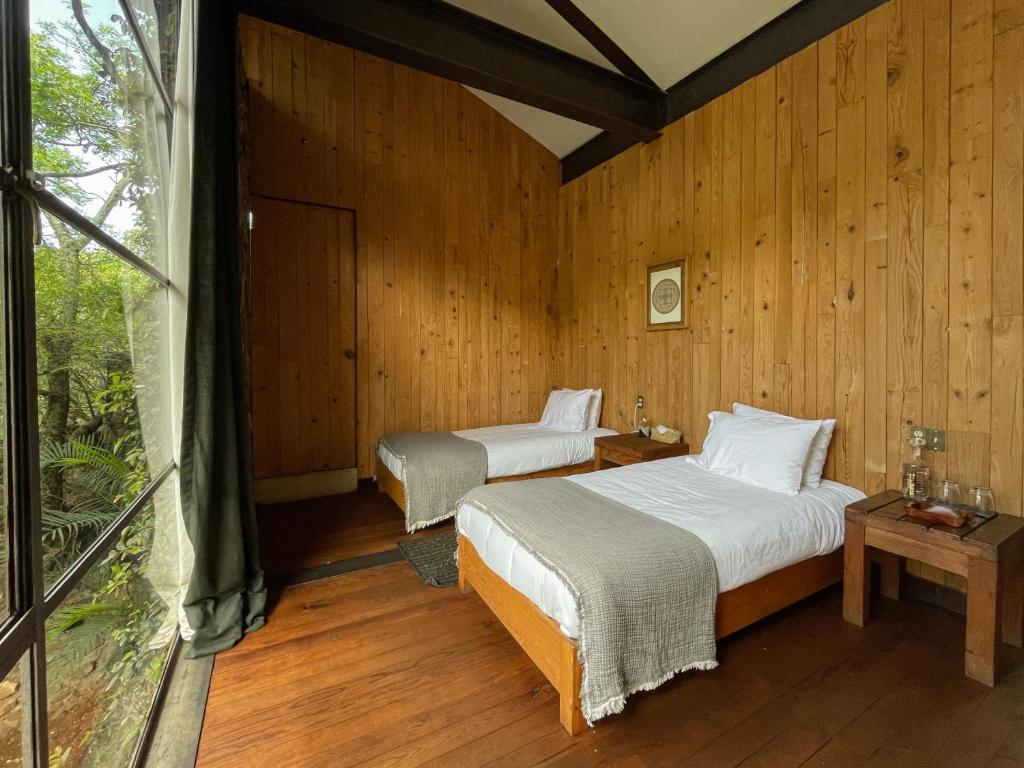 Postel nebo postele na pokoji v ubytování El Sereno Amatlán, Tepoztlán