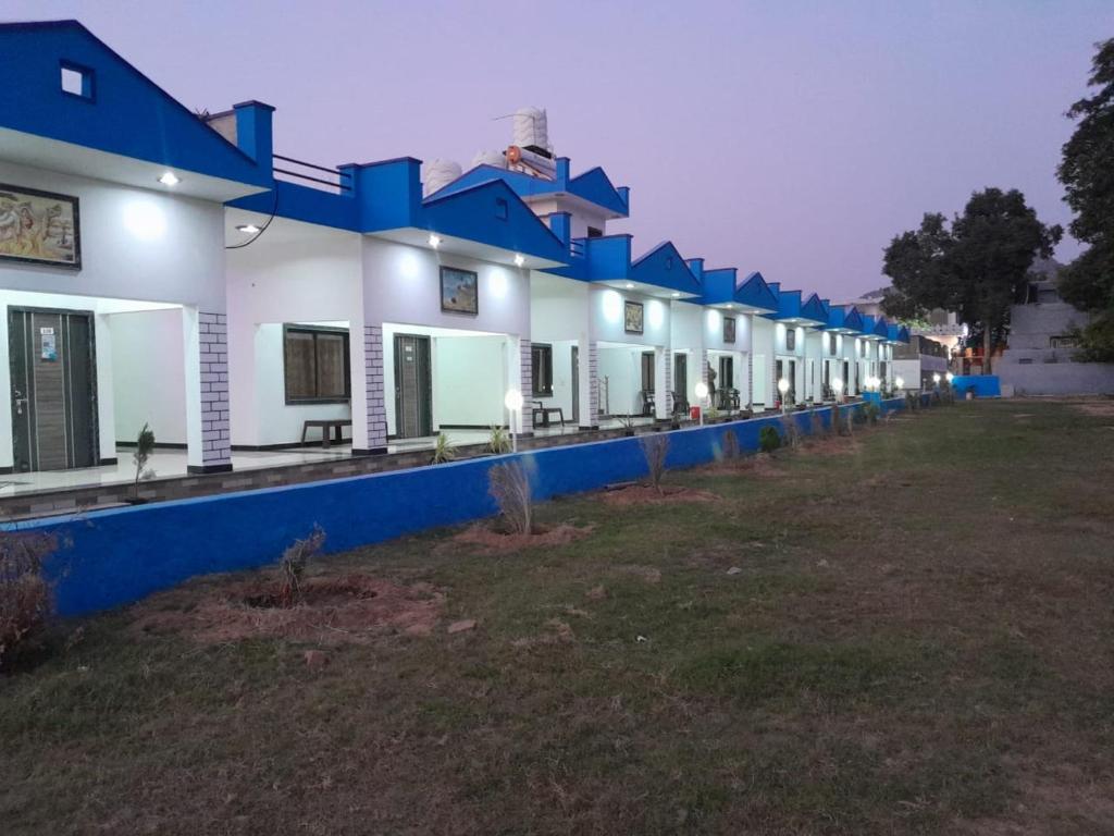 a row of houses with blue and white at Pushkar Prime Resort in Pushkar