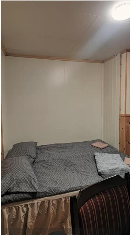 En eller flere senge i et værelse på Rose Rooms