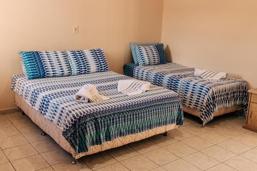 Postel nebo postele na pokoji v ubytování Hotel Nivs