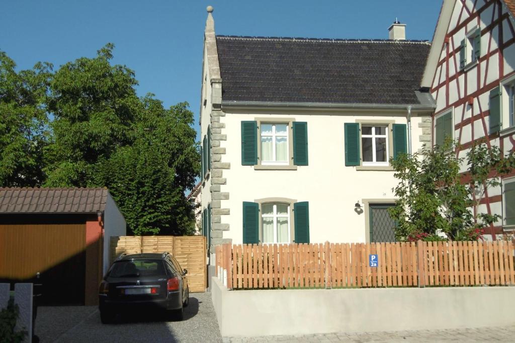 a car parked in front of a house at Schlößleweg 2a in Bodman-Ludwigshafen