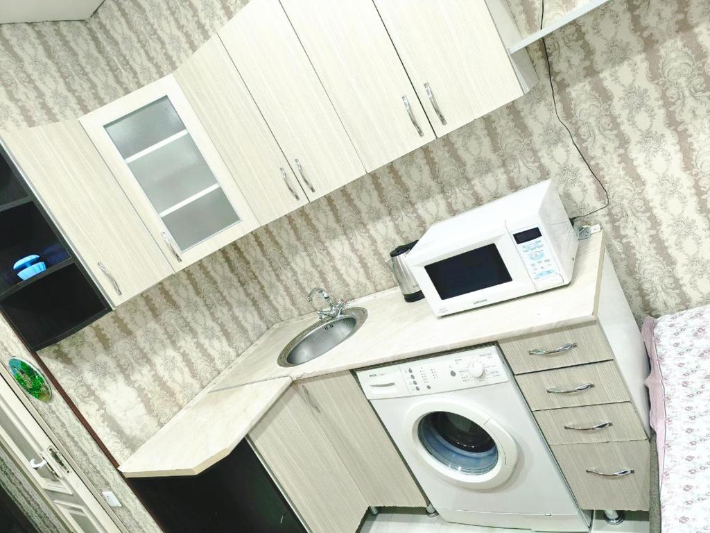 Kuchyň nebo kuchyňský kout v ubytování Parcul Ștefan cel mare și sfânt