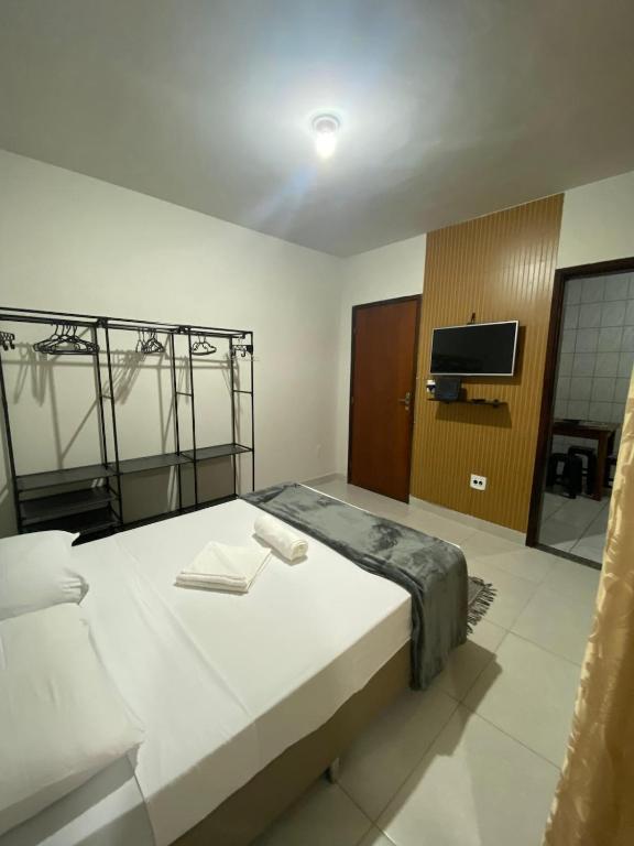 Ένα ή περισσότερα κρεβάτια σε δωμάτιο στο Apê moderno e aconchegante!