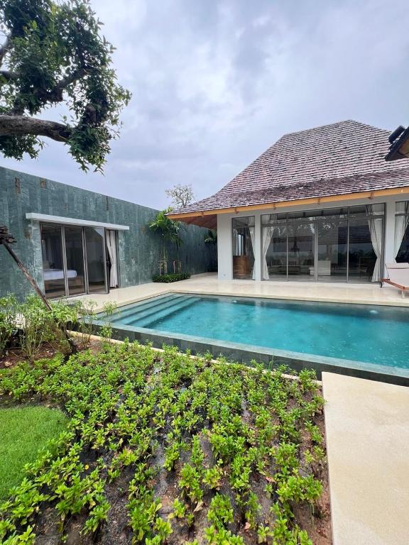 an image of a swimming pool in a house at Grand garden villa in Phuket