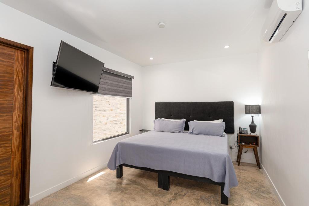 Postel nebo postele na pokoji v ubytování Hotel Manadia