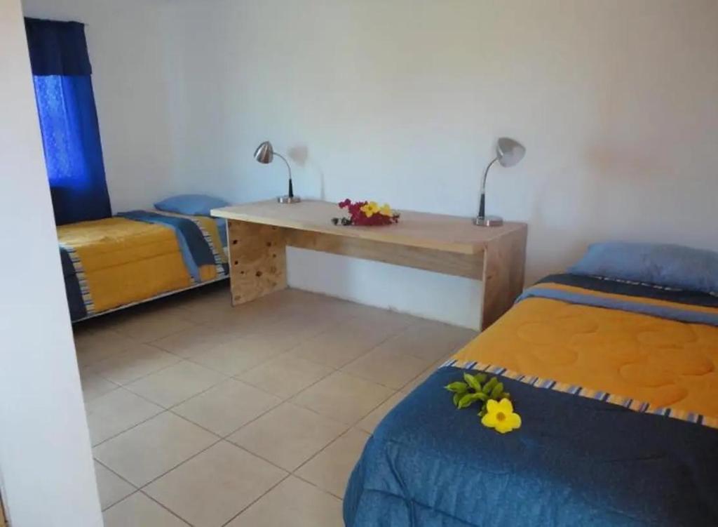 Postel nebo postele na pokoji v ubytování Cabañas Refugio Arqueologico