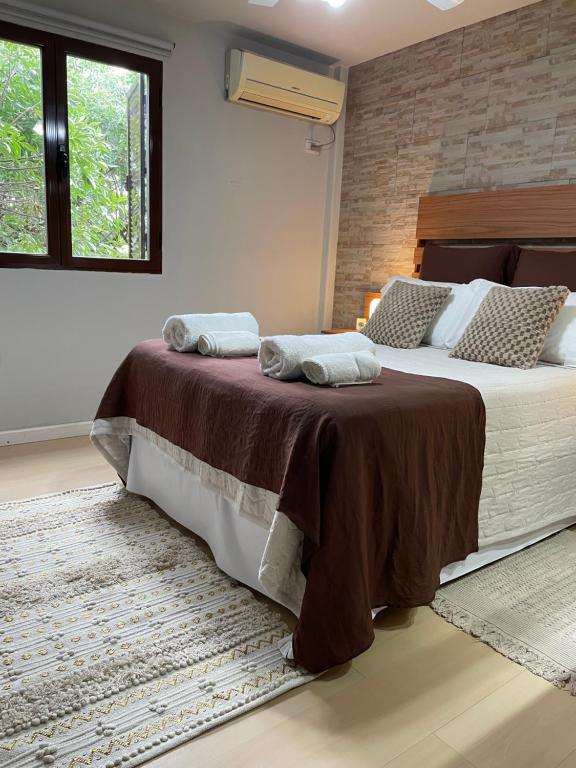 Ένα ή περισσότερα κρεβάτια σε δωμάτιο στο Lysa Paraná