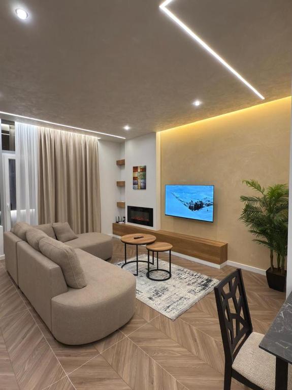 TV a/nebo společenská místnost v ubytování BI Suite