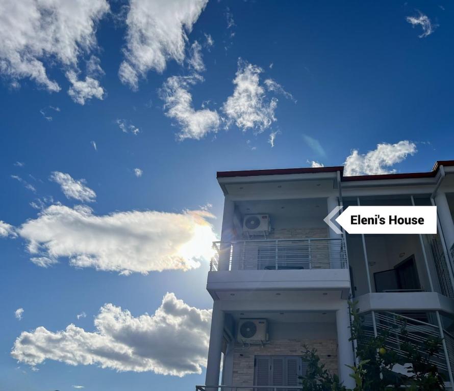 a building with a sign that reads interns house at Elenis House in Leptokaria