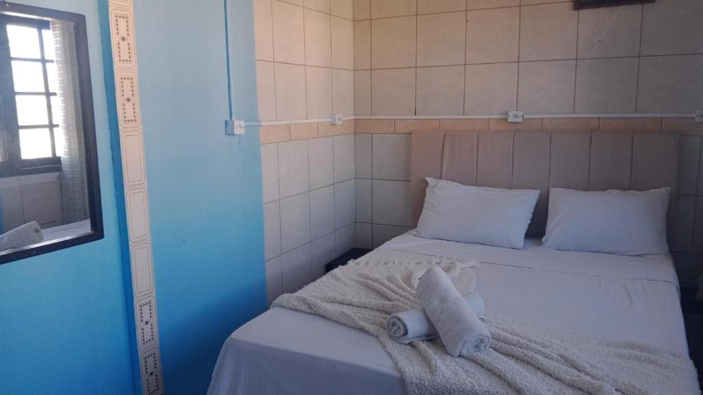 Ένα ή περισσότερα κρεβάτια σε δωμάτιο στο Pousada Top Mix 101