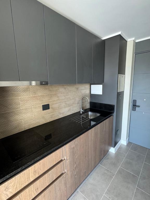 Kuchyň nebo kuchyňský kout v ubytování Icono studio