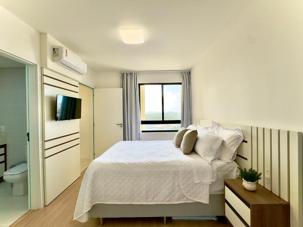 Voodi või voodid majutusasutuse Apto Penha a 300M PRAIA 8 min do BETO CARREIRO com PISICNA, sacada com CHURRASQUEIRA privativa, AR CONDICIONADO Wi Fi, PORTARIA 24h,vaga privativa de GARAGEM toas