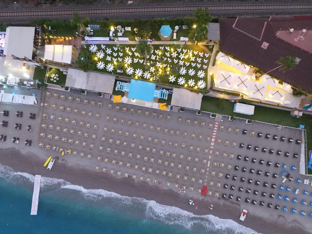 an overhead view of a cruise ship on the beach at Hotel Caparena in Taormina