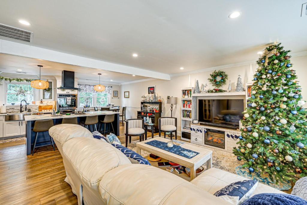 a living room with a christmas tree in it at 2 Mi to Beach Holiday Home in North Cape May in North Cape May