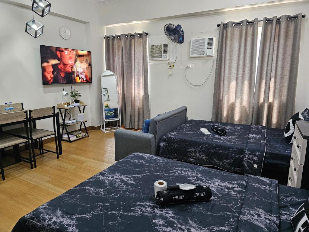Postel nebo postele na pokoji v ubytování Athena's Place - Hope Residences SMDC Trece Cavite