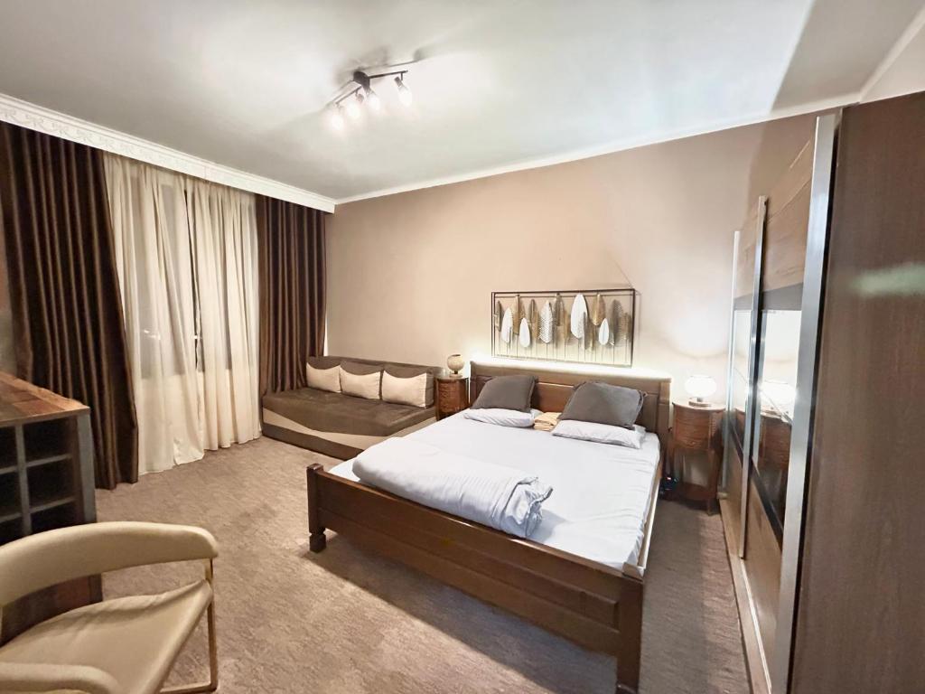 Postel nebo postele na pokoji v ubytování Apartment Centar