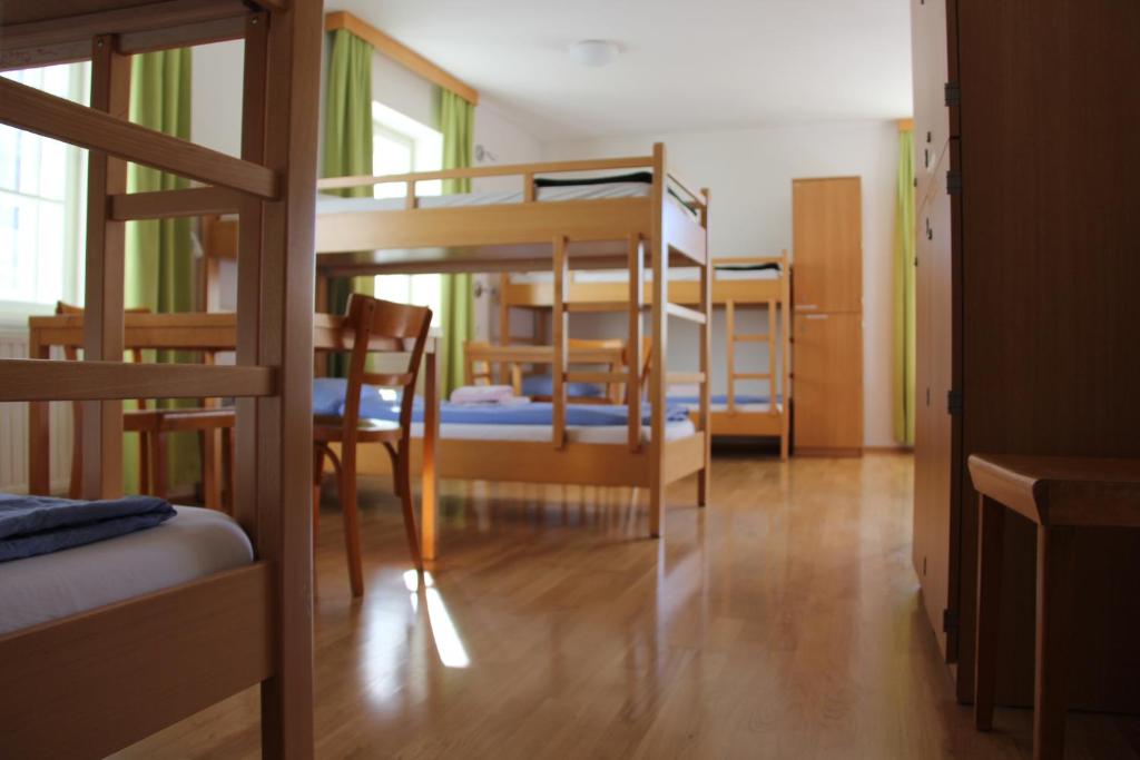 Postel nebo postele na pokoji v ubytování Institut St.Sebastian