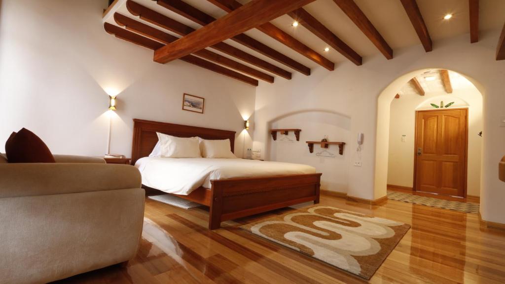 Ένα ή περισσότερα κρεβάτια σε δωμάτιο στο Casa Lucía Hotel by Las Plazas