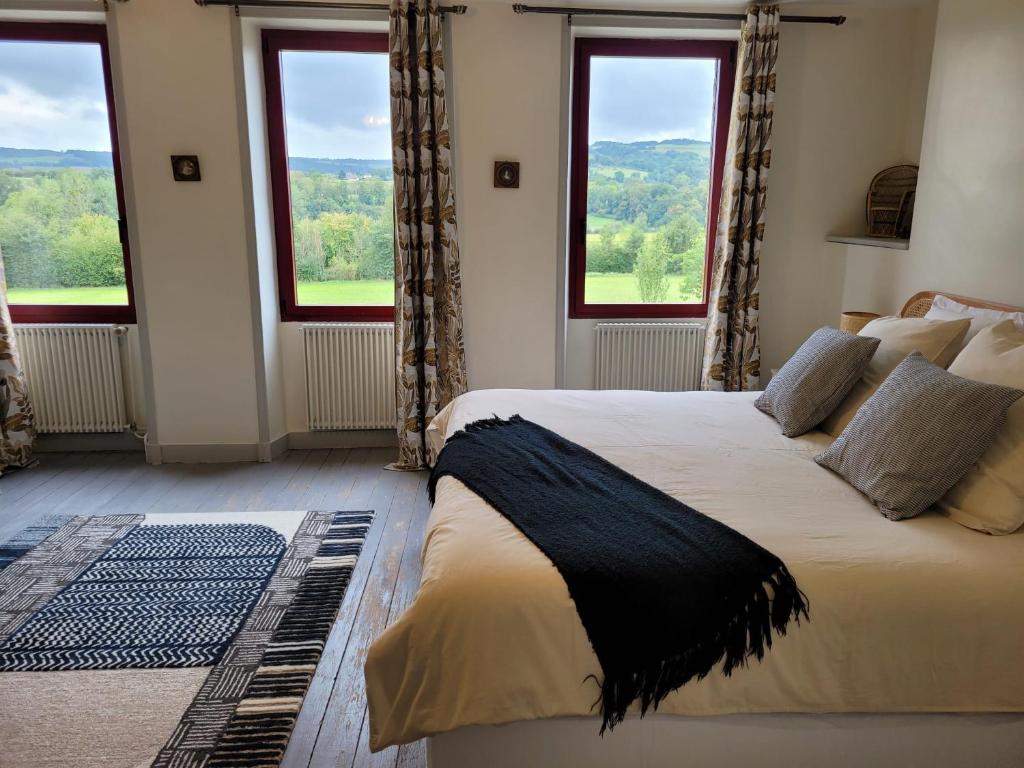 Ένα ή περισσότερα κρεβάτια σε δωμάτιο στο Lodge de La Vallée