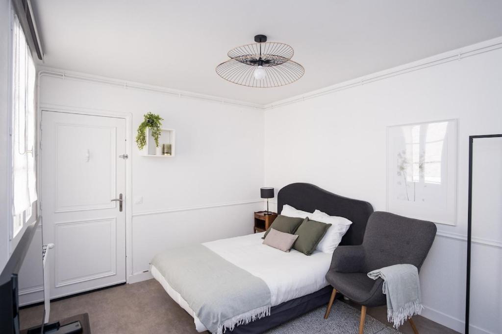 Postel nebo postele na pokoji v ubytování Phénix - SILS