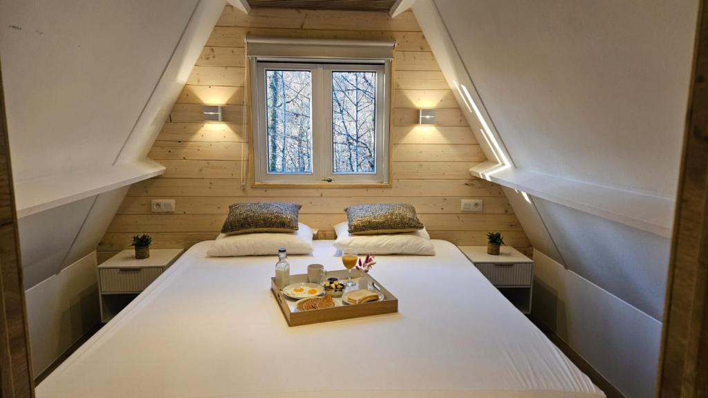 Ένα ή περισσότερα κρεβάτια σε δωμάτιο στο de bosdriehoek