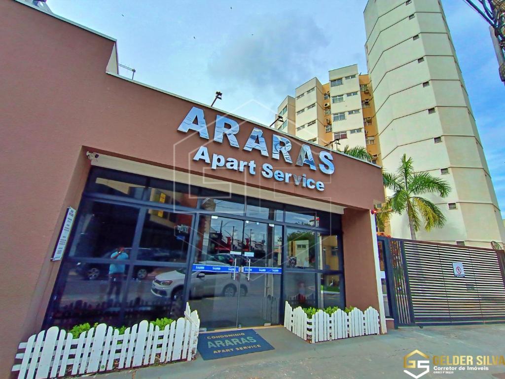 a store with a car parked in front of it at Flats CTC Araras in Caldas Novas