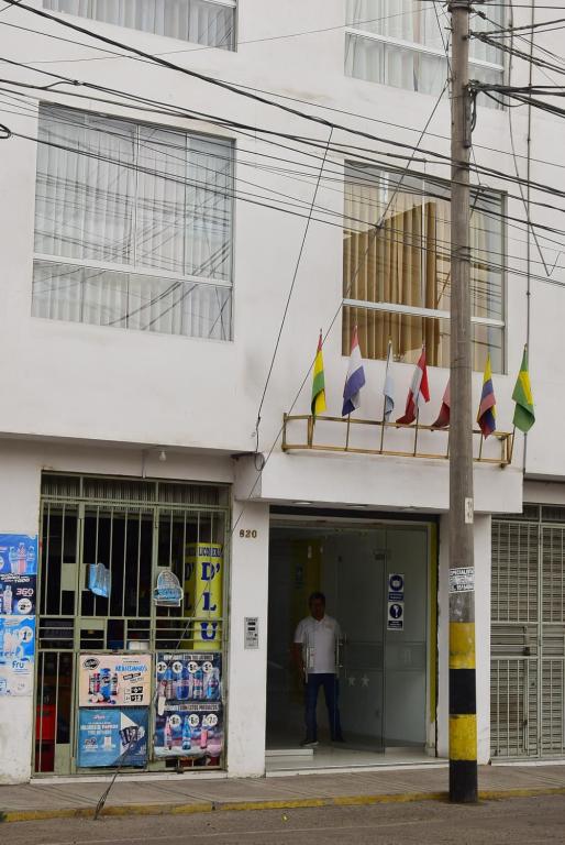 a man standing in the doorway of a building at Hotel Casa Real Tacna in Tacna