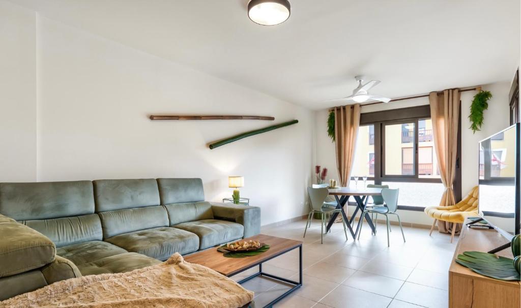 a living room with a couch and a table at Relax & Enjoy - El Mocan - Palm Mar in Palm-Mar