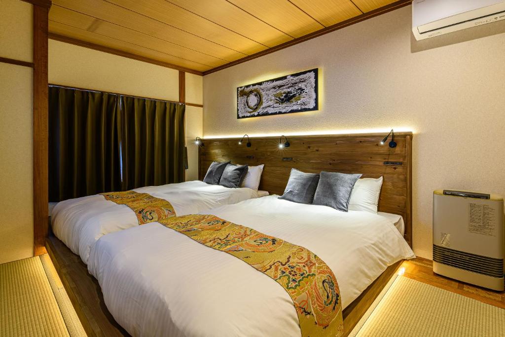 Ένα ή περισσότερα κρεβάτια σε δωμάτιο στο 函館大手町高田屋