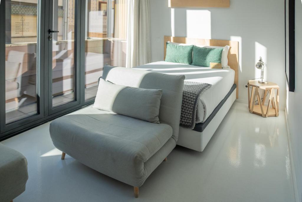 Postel nebo postele na pokoji v ubytování I Loft Porto