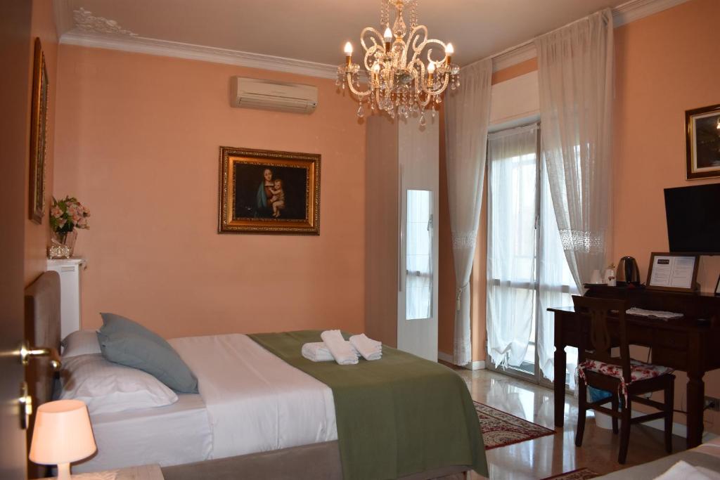 Ένα ή περισσότερα κρεβάτια σε δωμάτιο στο B&K Hotels