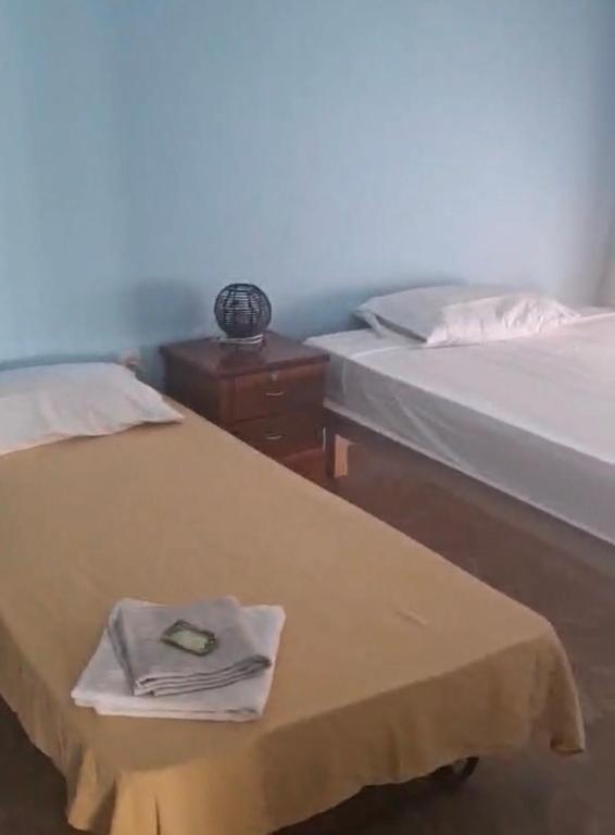 Giường trong phòng chung tại Kaza SZ