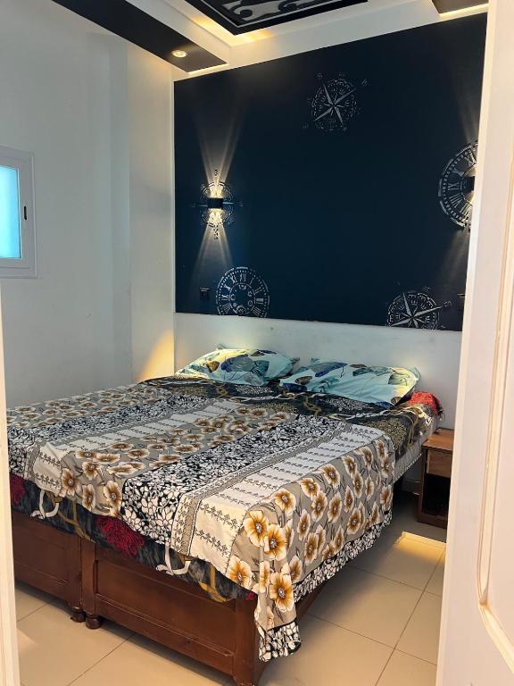 Ένα ή περισσότερα κρεβάτια σε δωμάτιο στο Le central