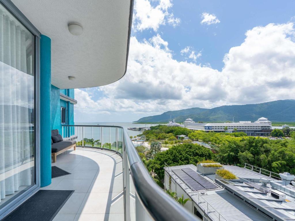 a balcony of a building with a view of the ocean at BreakFree Royal Harbour in Cairns