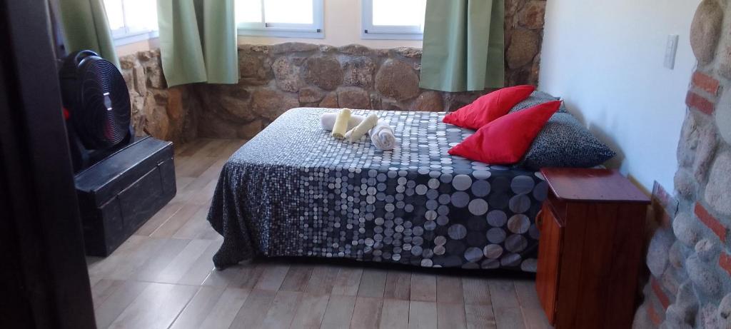 Ένα ή περισσότερα κρεβάτια σε δωμάτιο στο Casa on the rock's