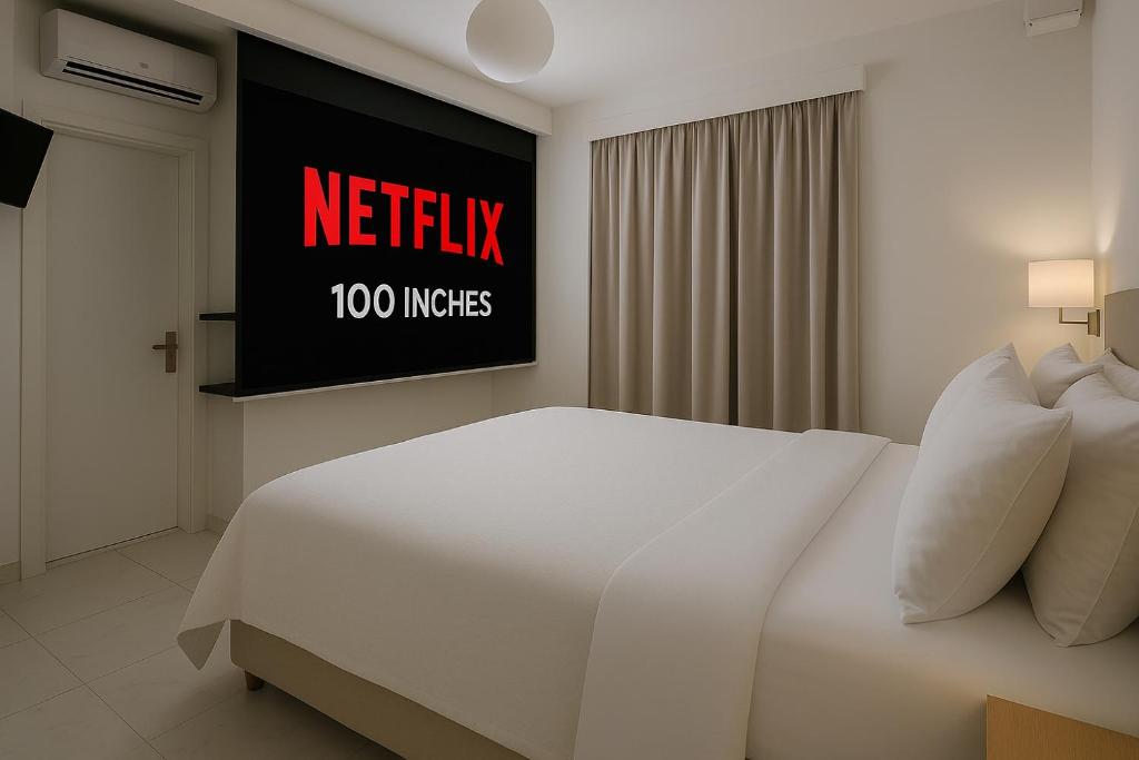 Un pat sau paturi într-o cameră la Alpha Studios Naxos - Adults Only