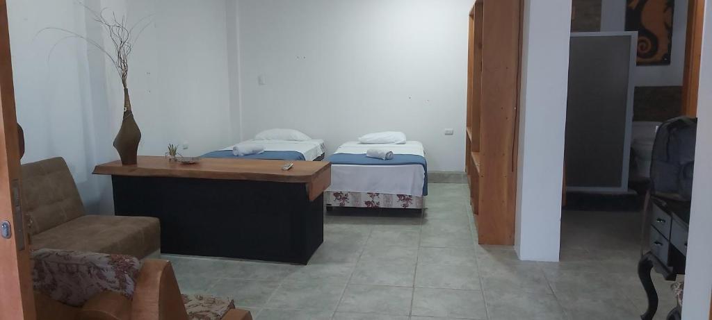 Postel nebo postele na pokoji v ubytování Akasha Galápagos