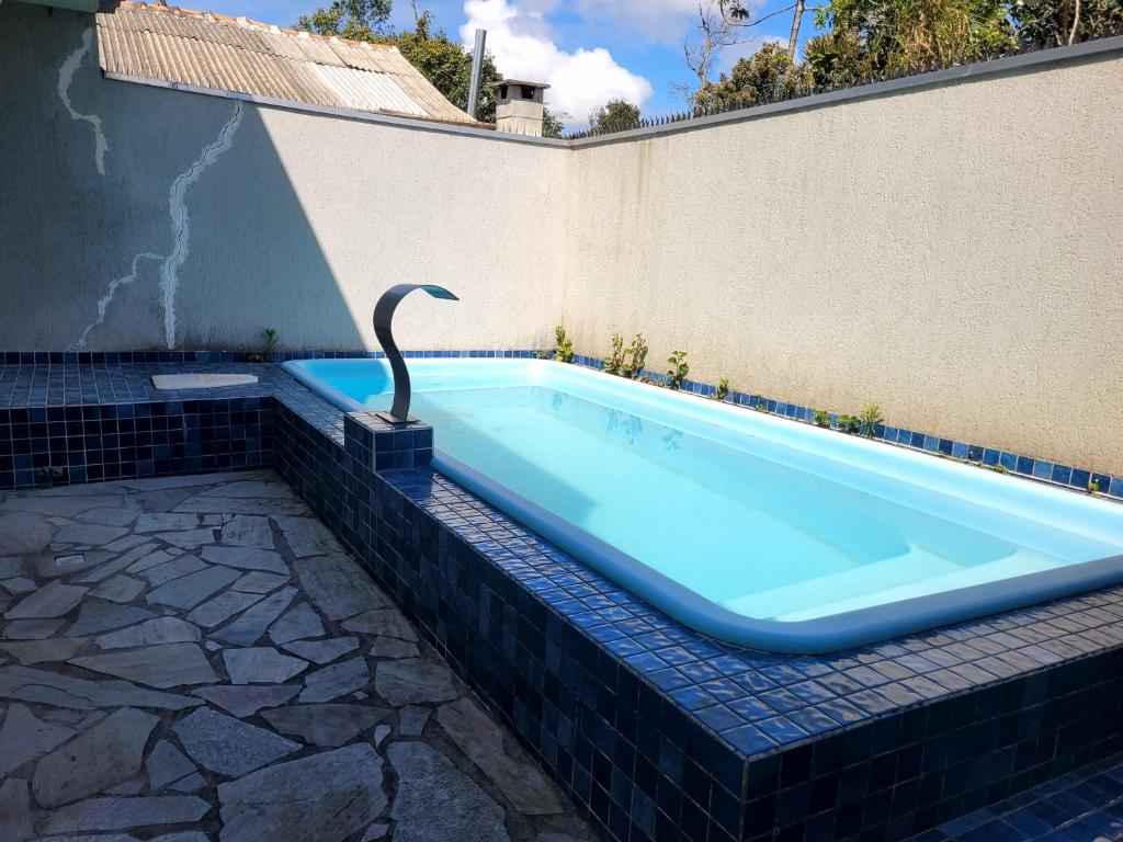 Πισίνα στο ή κοντά στο Praia de Leste Sobrado com piscina