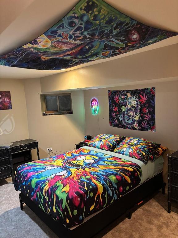 a bedroom with a bed with a painting on the ceiling at 420 Friendly 12 PM Check Out 1 Bedroom Basement in Chicago