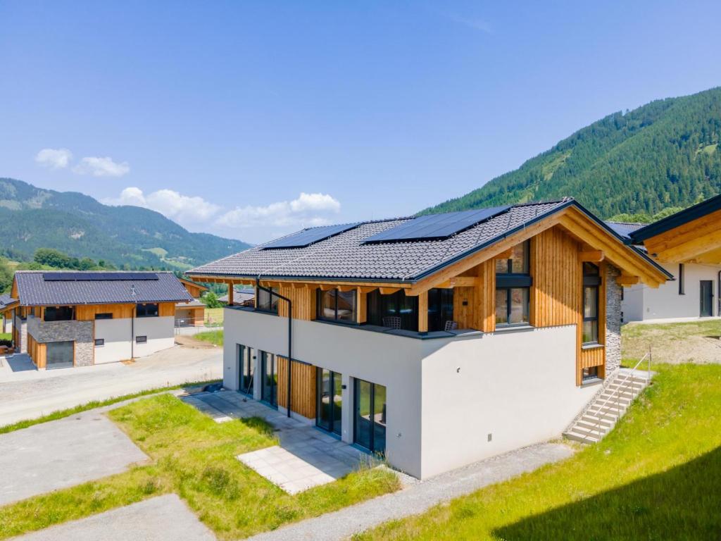a house with solar panels on the roof at Grebenzen Lodge 51B in Sankt Lambrecht