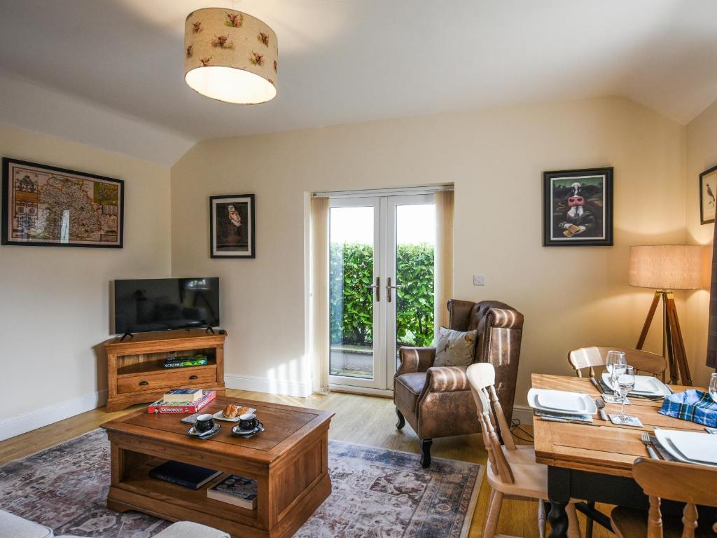 TV a/nebo společenská místnost v ubytování The Old Milking Parlour