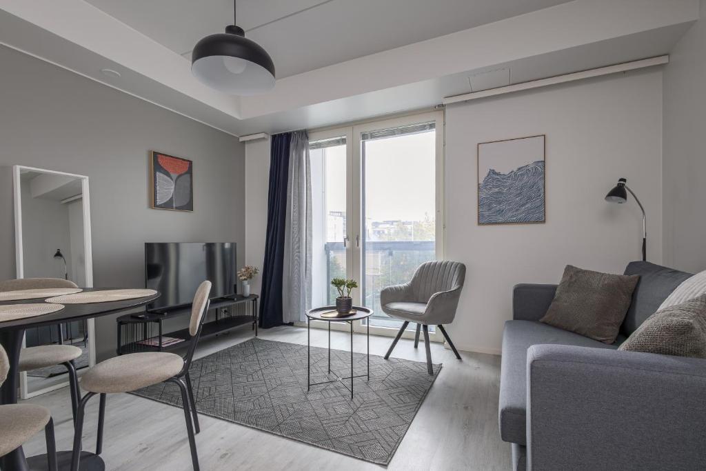 TV a/nebo společenská místnost v ubytování Pramea Apartments Asematalo