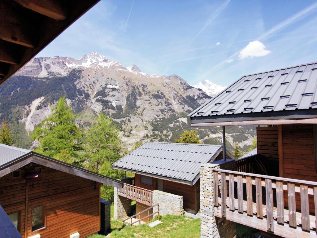 a view of a mountain from the balcony of a house at Chalet in Villarodin near Lake in La Norma