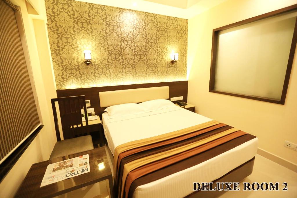 Postel nebo postele na pokoji v ubytování Hotel Deepam