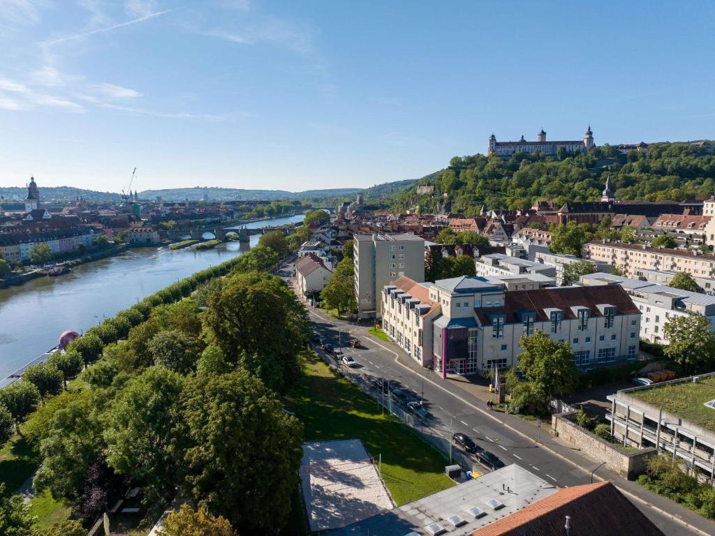 an aerial view of a city with a river at Mercure Hotel Würzburg am Mainufer in Würzburg