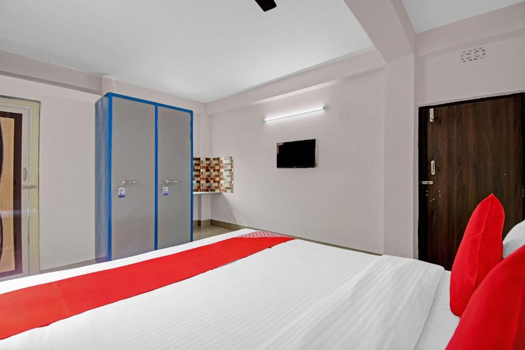 Ένα ή περισσότερα κρεβάτια σε δωμάτιο στο Super Hotel O Grand Eden