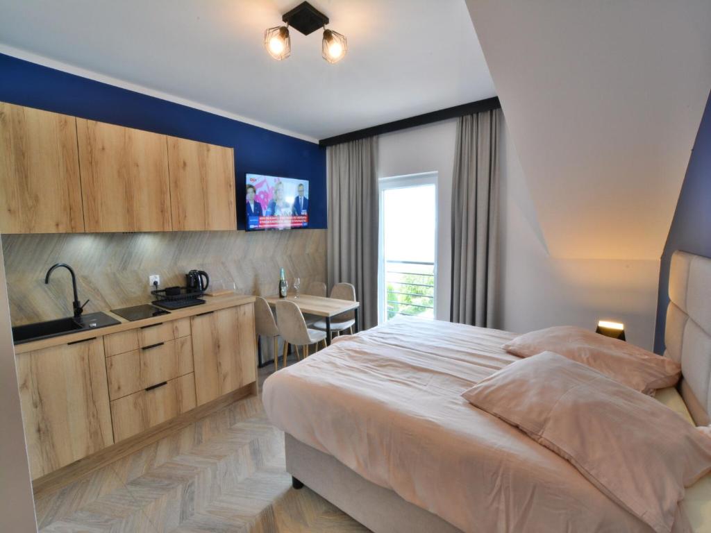 Ένα ή περισσότερα κρεβάτια σε δωμάτιο στο Apartment in Ustronie Morskie by the Beach
