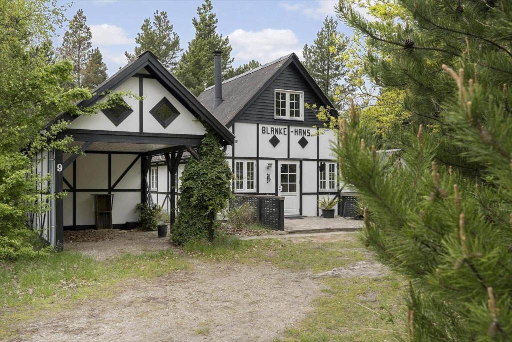 a white house with a black roof at 0496-Romo-Norre-Frankel-9 in Høm