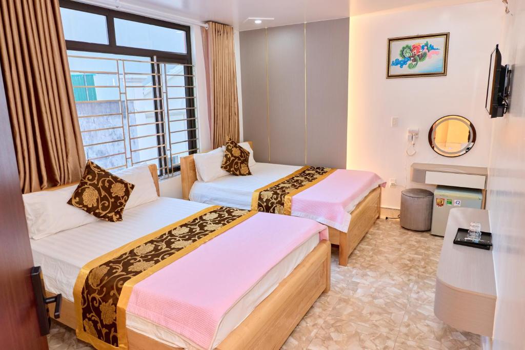 Ένα ή περισσότερα κρεβάτια σε δωμάτιο στο Ngoc Linh Hostel and Travel